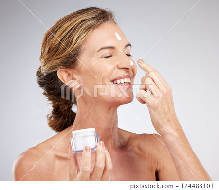Beauty, senior and face of woman with cream container for skincare hydration and anti aging. Grey studio mockup for facial creme product advertising with happy smile of ageing elderly lady. Beauty, senior and face of woman with cream container for skincare hydration and anti aging. Grey studio mockup for facial creme product advertising with happy smile of ageing elderly lady. 124483101