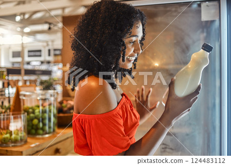 Woman, grocery shopping or reading milk label for sales date, vitamin information or calcium data in Brazilian store retail. Happy smile, supermarket customer or nutritionist and dairy fridge product Woman, grocery shopping or reading milk label for sales date, vitamin information or calcium data in Brazilian store retail. Happy smile, supermarket customer or nutritionist and dairy fridge product 124483112