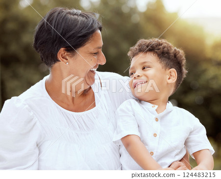 Family, relax and grandmother bond with grandchild at a park, happy and smiling in nature together. Love, happy family and elderly woman enjoying time with little boy in forest, laughing and talking Family, relax and grandmother bond with grandchild at a park, happy and smiling in nature together. Love, happy family and elderly woman enjoying time with little boy in forest, laughing and talking 124483215