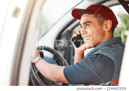 Phone call, delivery and courier talking on a mobile, working and driving for ecommerce business in a car. Young, happy and thinking logistics driver speaking about cargo on a smartphone in a van Phone call, delivery and courier talking on a mobile, working and driving for ecommerce business in a car. Young, happy and thinking logistics driver speaking about cargo on a smartphone in a van 124483359
