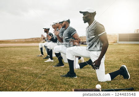 Baseball, sports and fitness with a team stretching on a grass pitch or field before a game outdoor. Exercise, training and workout with a male baseball player group getting ready for a sport match 124483548