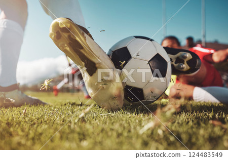 Soccer, soccer ball and man slide tackle during match, training or competition outdoors. Football, sports and football players on grass field for workout, fitness or exercise game on football pitch. 124483549