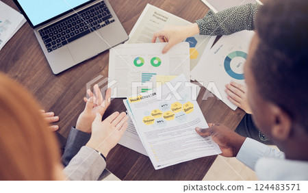 Business, group and above for data on chart, laptop and graph for analytics, finance and desk. Meeting, teamwork and paper for documents of financial strategy, planning and economy of market on table Business, group and above for data on chart, laptop and graph for analytics, finance and desk. Meeting, teamwork and paper for documents of financial strategy, planning and economy of market on table 124483571