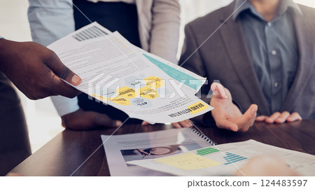 Business people hands, documents and marketing team planning, collaboration and analytics in advertising agency. Group project management, paperwork and brand activation strategy of kpi data analysis Business people hands, documents and marketing team planning, collaboration and analytics in advertising agency. Group project management, paperwork and brand activation strategy of kpi data analysis 124483597
