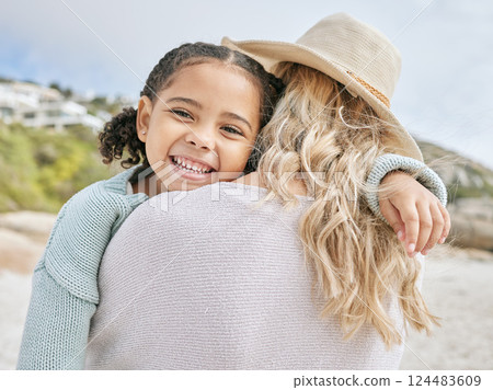 Mom, child and beach with smile, together and walking on vacation, happy and outdoor to relax. Black girl, mother and happiness for walk in summer, sand and holiday by ocean for diversity in family 124483609