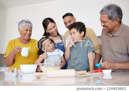 Children, baking and family with a boy tasting flour while learning to bake in the kitchen with parents, grandparents and sister. Kids, learning and love with a girl and boy cooking with relatives Children, baking and family with a boy tasting flour while learning to bake in the kitchen with parents, grandparents and sister. Kids, learning and love with a girl and boy cooking with relatives 124483663