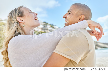 Beach, hug and interracial love of couple with happy and cheerful smile enjoy vacation in Brazil. Happiness, care and romance of lovers embracing for joyful moment on ocean holiday break. 124483721