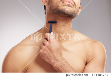 Razor, man and shaving beard in studio for skincare, grooming routine and personal hygiene. Hair removal, cleaning neck and person with cosmetic tool for depilation and self care on gray background 124483757