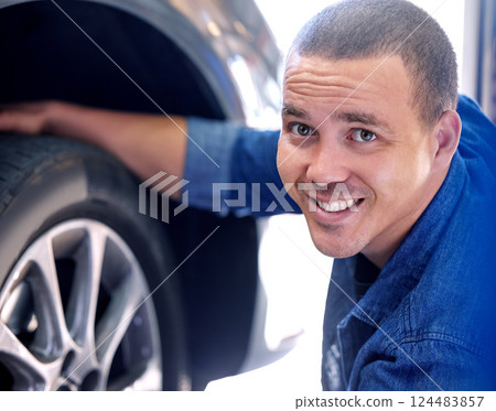 Mechanic, tire change and happy man car service assistant in automobile shop or road side assistance. Wheel safety, break pad inspection and professional automobile maintenance worker in motor garage 124483857