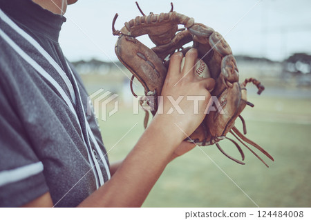 Baseball player, hands or ball in mitt on grass field for fitness, workout and training in game, match and competition. Zoom, baseball glove and sports athlete in energy exercise for softball pitcher Baseball player, hands or ball in mitt on grass field for fitness, workout and training in game, match and competition. Zoom, baseball glove and sports athlete in energy exercise for softball pitcher 124484008