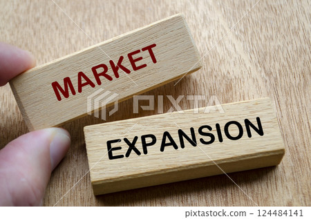 Market Expansion text on wooden blocks. Market and Business strategy concept 124484141