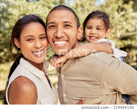 Portrait of mom, dad and girl at the park having fun, bonding and playing together on weekend. Summer, love and multicultural family enjoy sunny day in nature, garden and outdoor with smile on face 124484150
