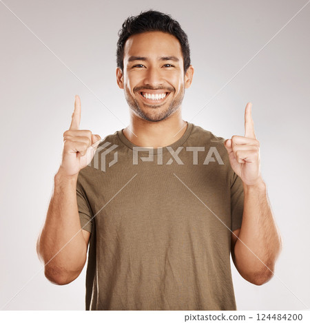 Studio, man and portrait with pointing up for advertising, announcement and breaking news for offer. Smile, salesperson and choice with hand gesture for promotion, information and white background Studio, man and portrait with pointing up for advertising, announcement and breaking news for offer. Smile, salesperson and choice with hand gesture for promotion, information and white background 124484200
