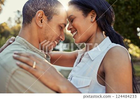 Hug, love and couple in a park on a holiday in Morocco for marriage, care and freedom together. Happy, young and man and woman with mile for affection, happiness and vacation in nature in summer 124484233