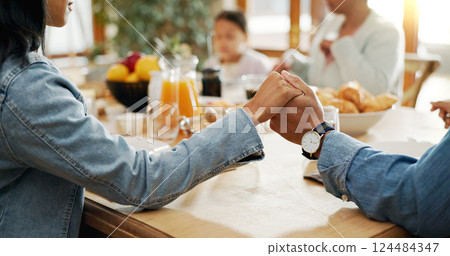 Meal, family or holding hands to pray for love, gratitude or holiday brunch in closeup for feast. Group, support or people at table together for sharing supper, lunch or food in home for grace 124484347