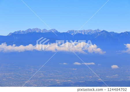 View of the Northern Alps and Matsumoto Plain from Ogahana 124484702