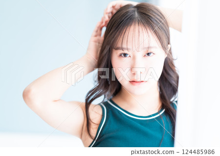 Beauty portrait of a healthy young woman in a tank top Beauty portrait of a healthy young woman in a tank top 124485986