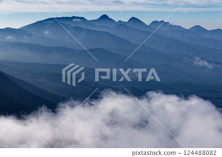 The main peaks of the Yatsugatake Mountains seen in the morning mist from Mt. Tateshina 124488082