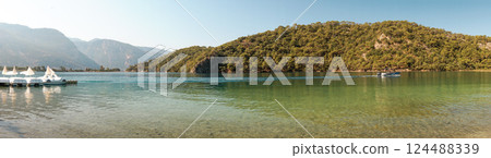 Calm Blue Lagoon on a Clear Summer Day - A Tropical Paradise for Relaxation Calm Blue Lagoon on a Clear Summer Day - A Tropical Paradise for Relaxation 124488339