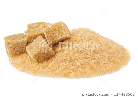 Pile of brown granulated sugar and sugar cubes isolated on white background. Pile of brown granulated sugar and sugar cubes isolated on white background. 124488508