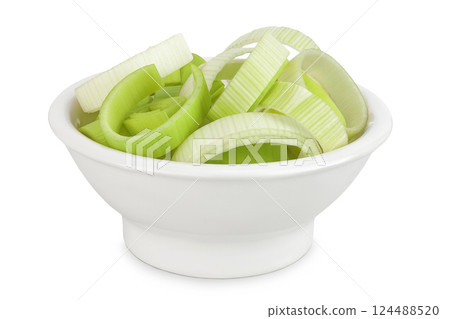 sliced Leek vegetable in ceramic bowl isolated on white background with full depth of field 124488520