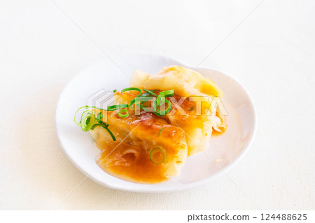 Sweet and sour gyoza dumplings 124488625