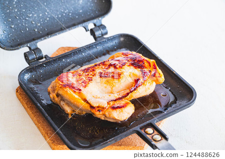 Chicken steamed on a hot sandwich plate 124488626