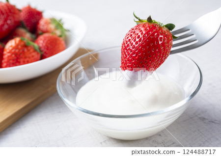 Strawberries in plain yogurt 124488717