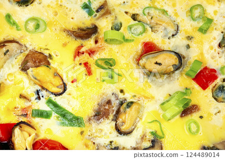 Homemade egg omelette with mussels. Homemade egg omelette with mussels. 124489014