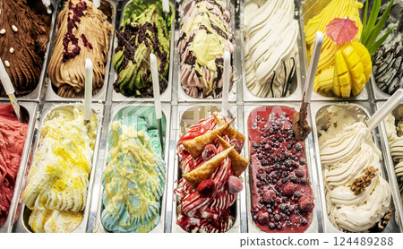 Assortment of colorful artisanal gelato ice cream in a display case 124489288