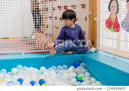 Boy playing with indoor playset Boy playing with indoor playset 124489407