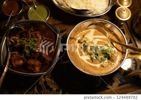Indian dish, chicken in curry sauce and cheese in spicy sauce, top view Indian dish, chicken in curry sauce and cheese in spicy sauce, top view 124489782