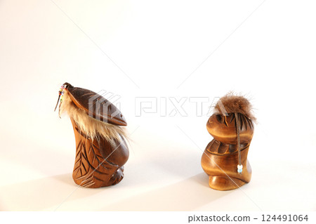 Folk art of the Chukchi figurines of gods Wealth and Health carved by craftsmen manually from wood 124491064