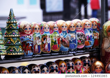 Kiev, Ukraine November 15, 2019: Folk art folding dolls Matryoshka selling them on a city street 124491065