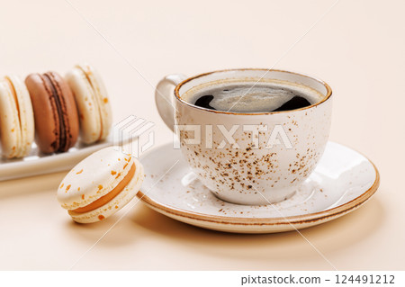 A delightful combination of freshly brewed coffee and delicate macaroons 124491212