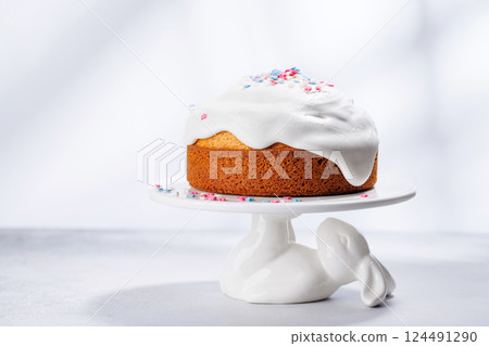 Traditional Easter cake decorated with colorful icing and sprinkles, symbolizing the festive spirit Traditional Easter cake decorated with colorful icing and sprinkles, symbolizing the festive spirit 124491290