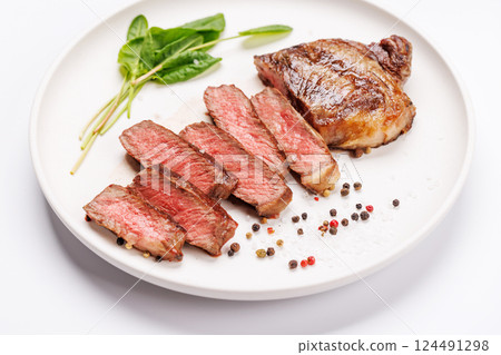 A perfectly cooked sliced striploin steak with a juicy, tender texture 124491298
