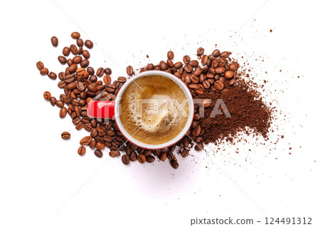 A steaming cup of freshly brewed coffee surrounded by rich, aromatic roasted coffee beans 124491312