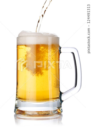 A glass of beer with a golden hue and frothy head, isolated on a clean white background 124491313