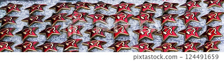 Kiev, Ukraine November 15, 2019: badges of the era of the Soviet Union are sold as a rarity on a city street 124491659