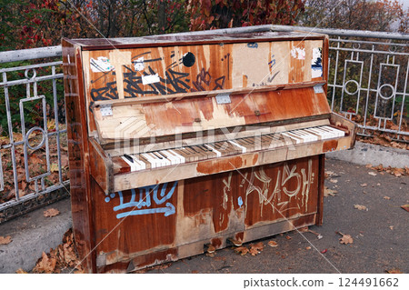 Kiev, Ukraine October 23, 2019: Old piano in the park for everyone to play Kiev, Ukraine October 23, 2019: Old piano in the park for everyone to play 124491662