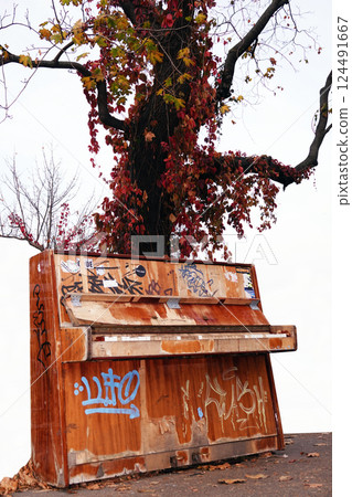 Kiev, Ukraine October 23, 2019: Old piano in the park for everyone to play 124491667