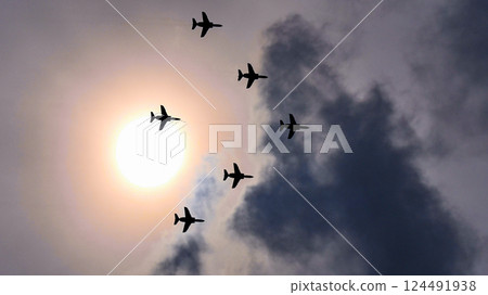 Flying in formation with the sun at our backs Flying in formation with the sun at our backs 124491938