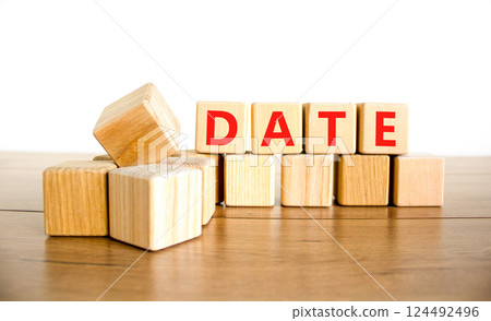 Date symbol. Concept word Date on beautiful wooden blocks. Beautiful wooden table white background. Business and date concept. Copy space. 124492496