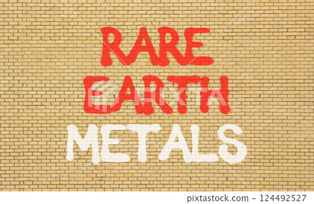 Rare earth metals symbol. Concept words Rare earth metals on beautiful brick wall . Beautiful brick wall background. Business and rare earth metals concept. Copy space. 124492527
