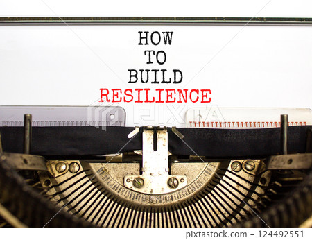 How to build resilience symbol. Concept words How to build resilience typed on beautiful old typewriter. Beautiful white table white background. Business how to build resilience concept. Copy space. 124492551