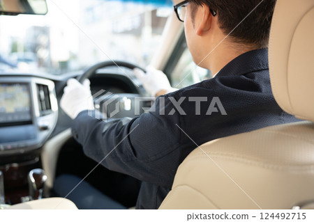 A man driving 124492715