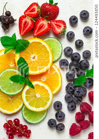 mix of fruits and berries,set, assortment, sliced citrus fruits, raspberries, blueberries, mint leaves, strawberries, red currants, food background, fruit wallpaper, 124493850