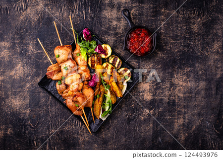 Chicken skewers kebab with vegetables 124493976