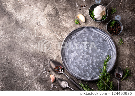 Rosemary, garlic, salt and pepper. 124493980